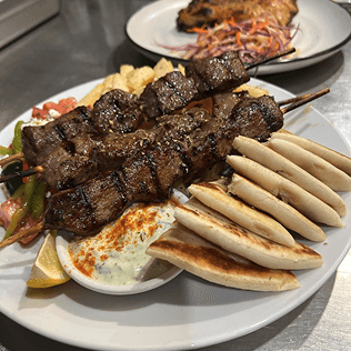 Traditional Greek mezze platter showcasing authentic Mediterranean dishes and family recipes